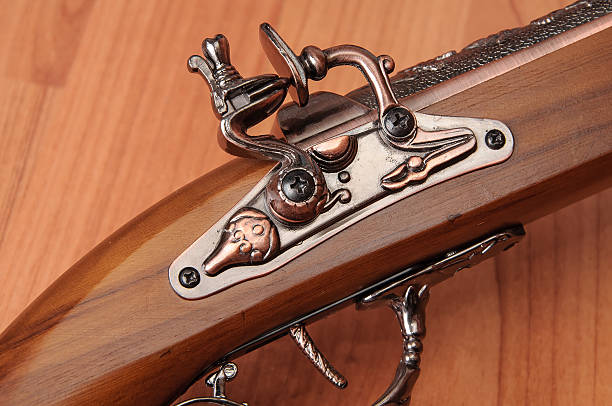 istock Vintage pistols on wooden background 598830380