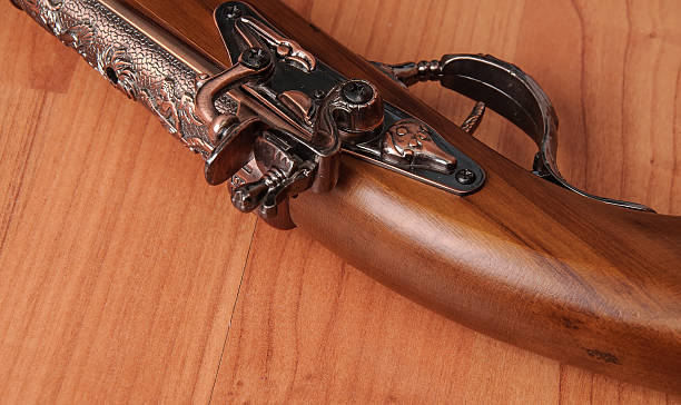 istock Vintage pistols on wooden background 598830442