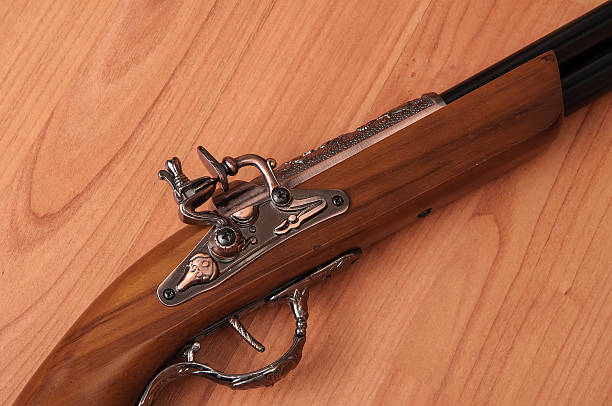 istock Vintage pistols on wooden background 598830714