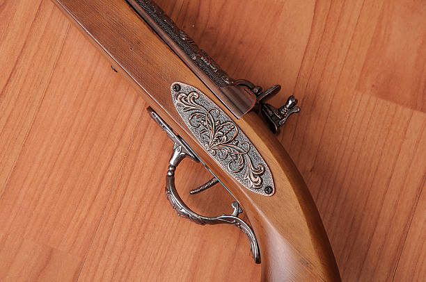 istock Vintage pistols on wooden background 598830794