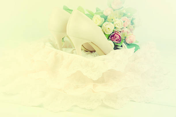istock Bride shoes with flowers. 598918354