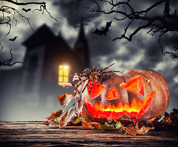 istock Scary halloween pumpkin with horror background 598921000