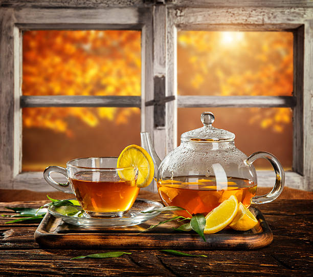 istock Autumn still life with tea cup on wooden planks 598922090