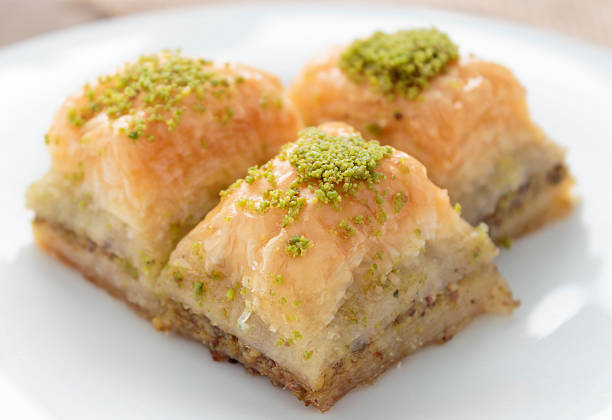 istock Baklava with pistachios and walnuts on white plate 598922424