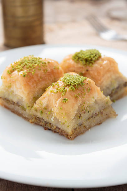 istock Baklava with pistachios and walnuts on white plate 598922826