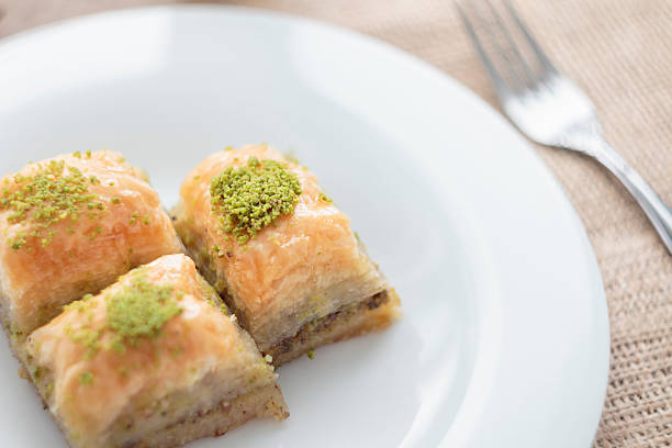 istock Baklava with pistachios and walnuts on white plate 598922938