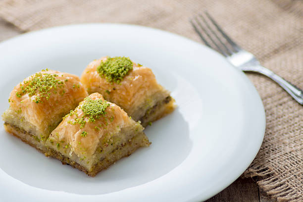 istock Baklava with pistachios and walnuts on white plate 598922992