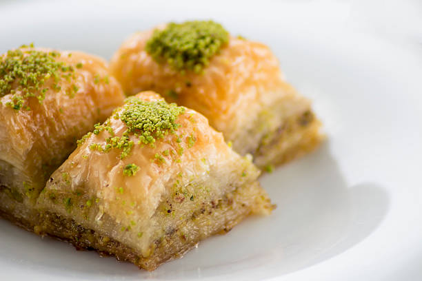 istock Baklava with pistachios and walnuts on white plate 598923042
