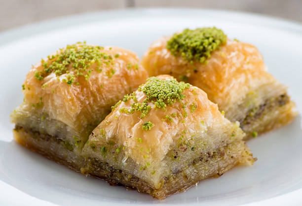 istock Baklava with pistachios and walnuts on white plate 598923066