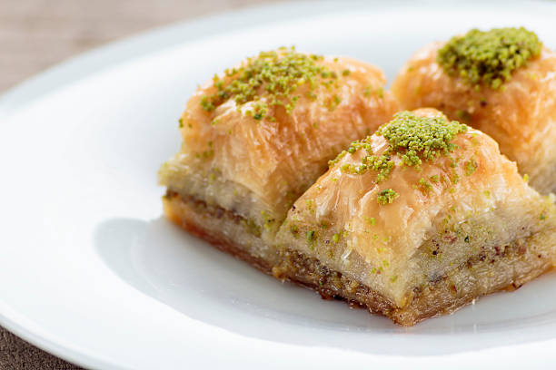 istock Baklava with pistachios and walnuts on white plate 598923118