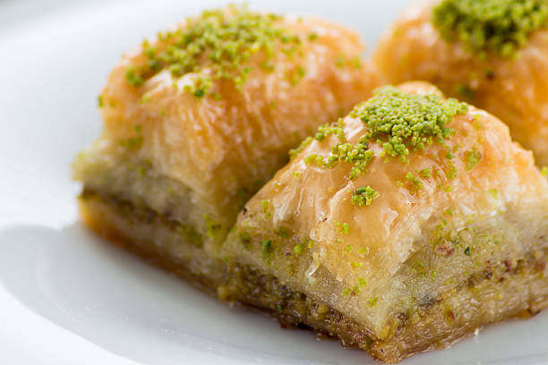 istock Baklava with pistachios and walnuts on white plate 598923158