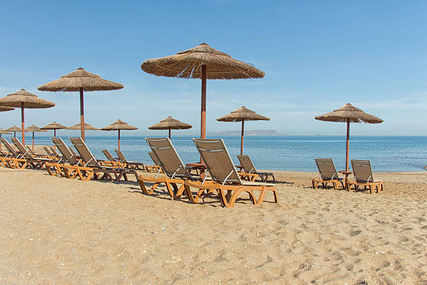 istock Parasols and sun loungers on the beach 598923654