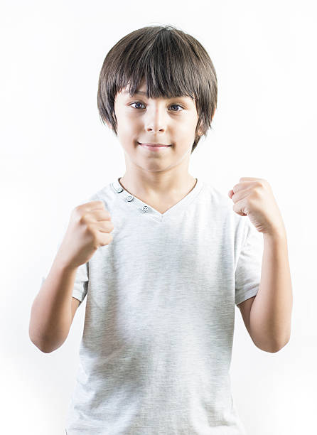 Happy little boy celebrating success