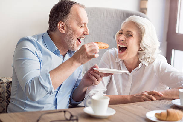 istock Overjoyed senior couple having lunch in the cafe 598925468