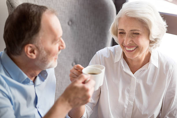 istock Cheerful delighted couple drinking coffee 598925982