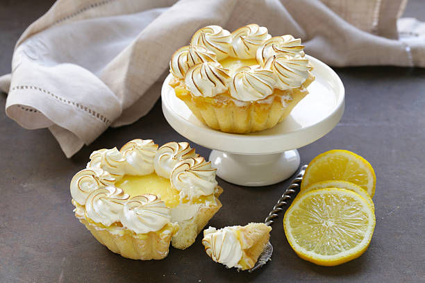 istock tartlet with lemon cream and meringue on a table 598929588