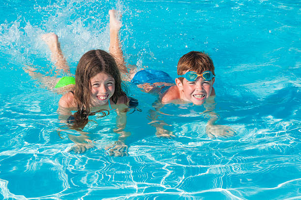istock Children having fun in water 598930440