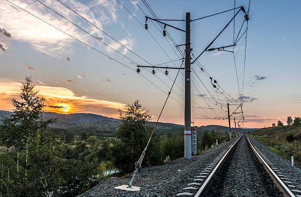 Republic of Bashkortostan, Russia. Railway in the Ural mountains at sunset.