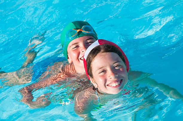istock Children in swimming pool 598931860