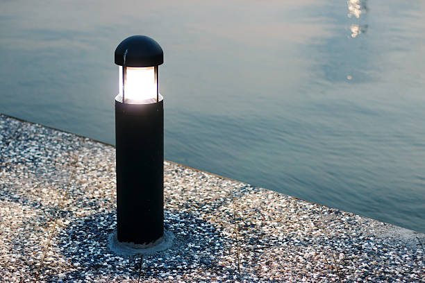 istock Street-lamp on sea background 598934254