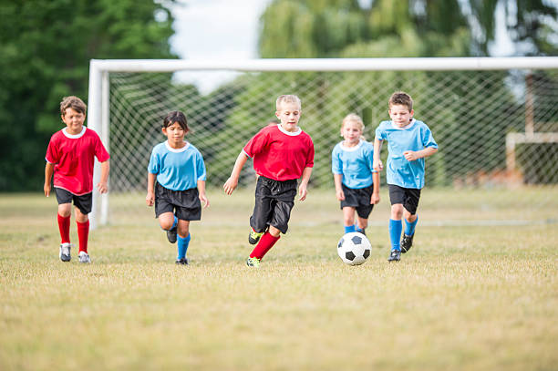 istock Kicking the Ball up the Field 598934494