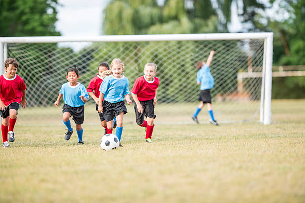 istock Dribbling the Ball Down the Field 598934496