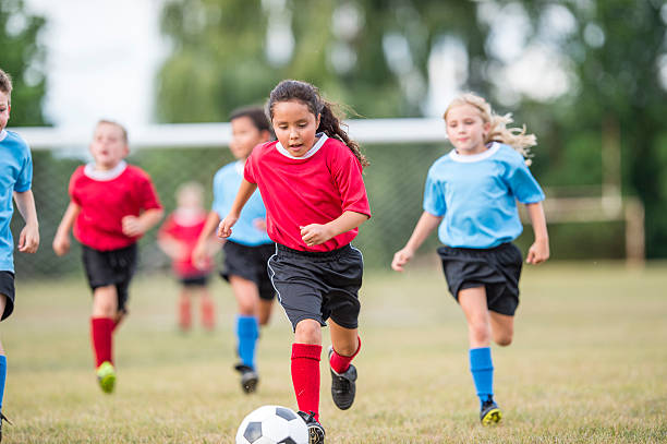 istock Young Children Playing Soccer 598934522