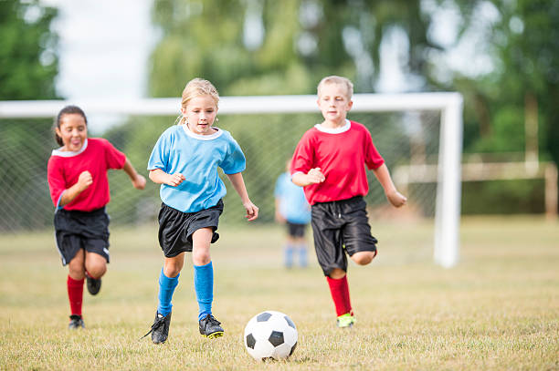 istock Children Playing a Soccer Game 598934556