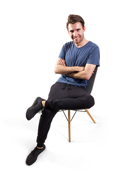 istock handsome young man sitting on the chair, clipping path included 598935576