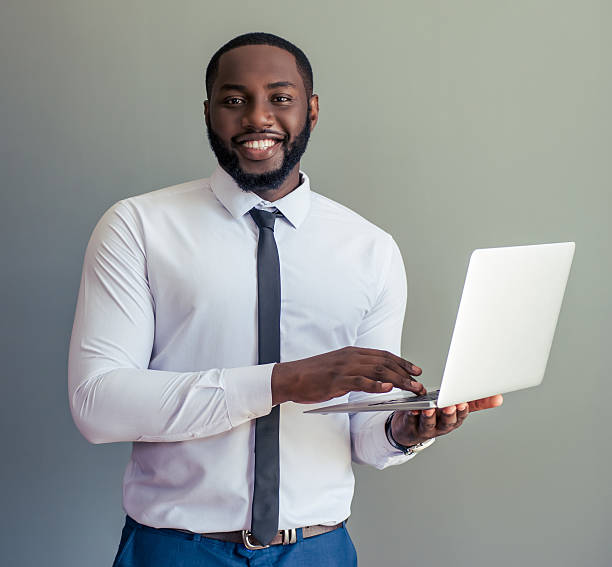 istock Afro American businessman with gadget 598936586