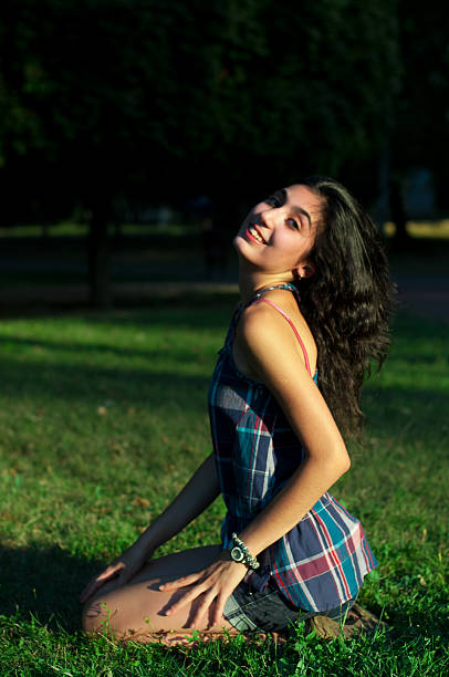 istock girl with glasses in the park 598937604
