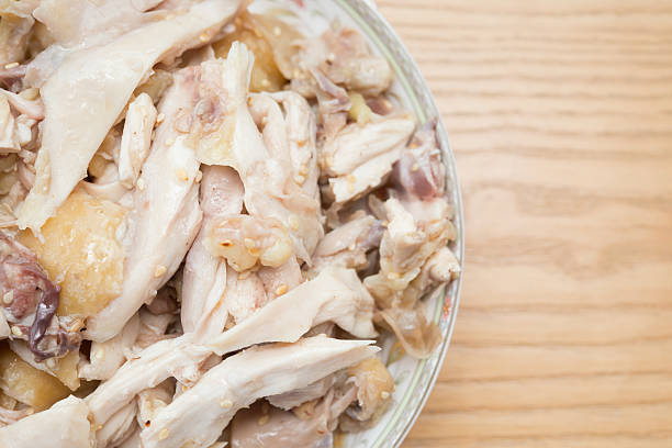 istock dish of shredded boiled chicken on wood table 598949336