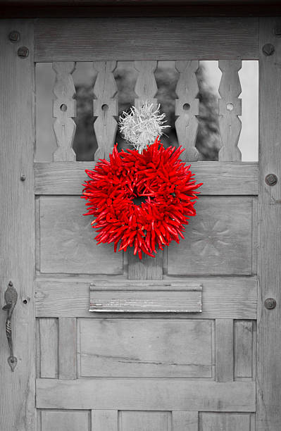istock Santa Fe Style: Chili Pepper Ristra Wreath on Wood Door 598950714