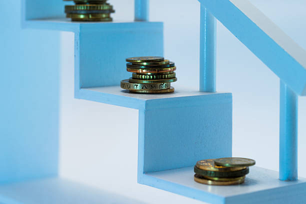 istock Financial planning concept. Coins on white steps. 598950872