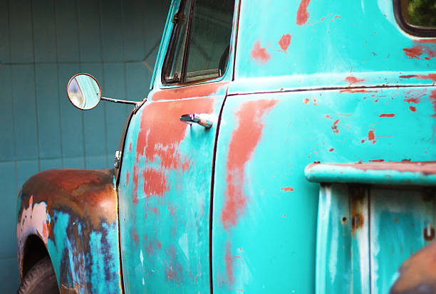 Distressed Turquoise Vintage Pickup Truck(Close-Up) Distressed turquoise-green vintage pickup truck, with sharpest focus on little round side mirror (close-up). distressed rusty vintage pickup truck close up detail stock pictures, royalty-free photos & images