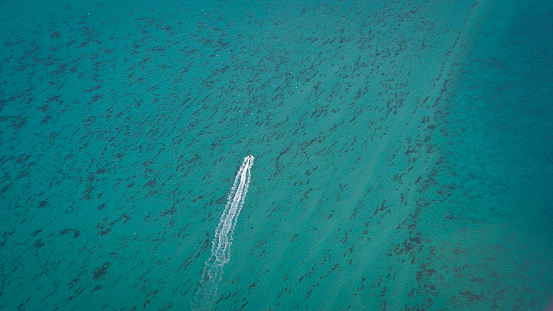 Aerial photograph of a boat in the bay.