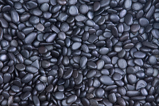 istock Background texture of waterworn black pebbles 598952810