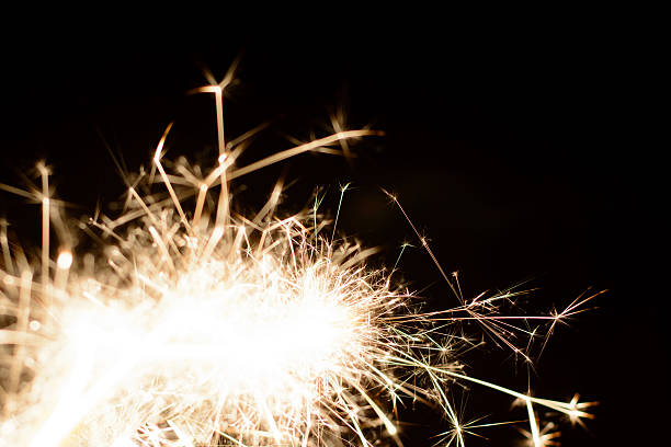 istock Burning sparkler isolated on black background 598953024