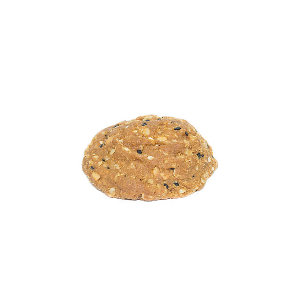 istock Oatmeal cookies with nuts and sesame seeds isolated 598954230