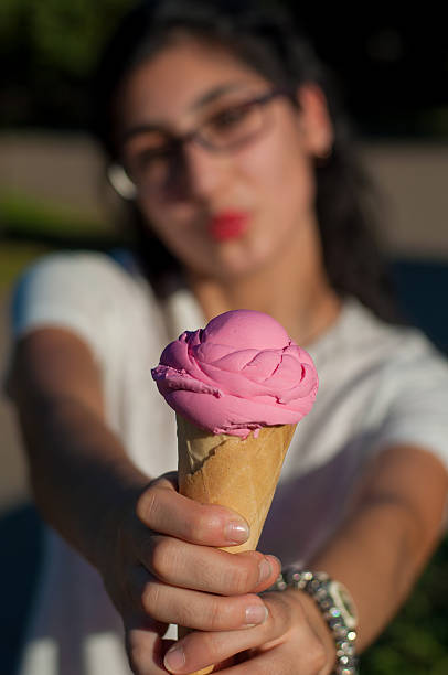 istock Girl with ice cream on the nature 598954682