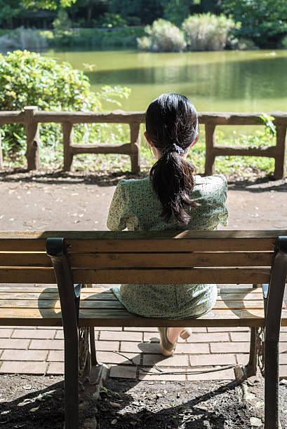 Woman sitting on the bench.