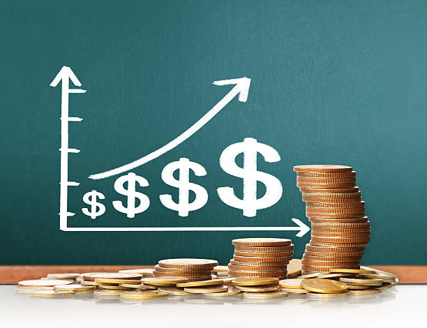 istock Coins graph stock market 598959196