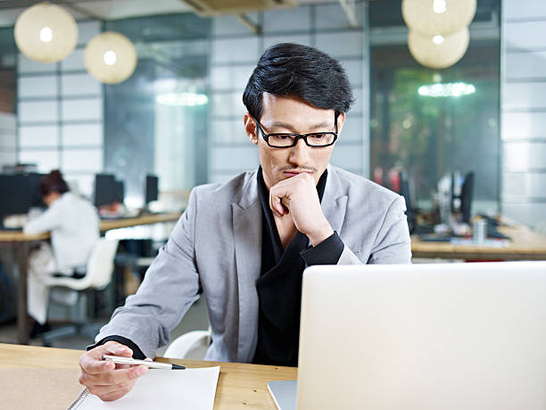 young asian businessman working in office