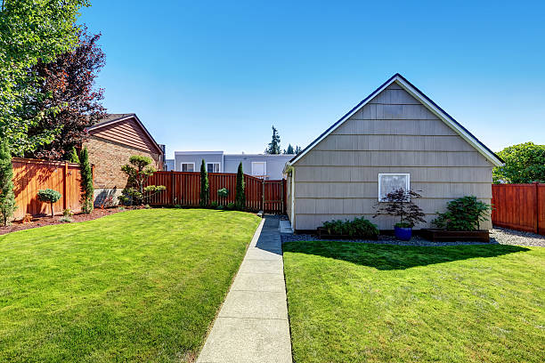 istock Backyard area with garage and perfectly trimmed garden. 598959932