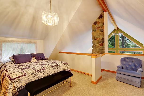 istock Vaulted ceiling bedroom interior upstairs 598961056
