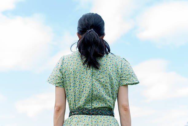 istock Woman on the sky background 598961270