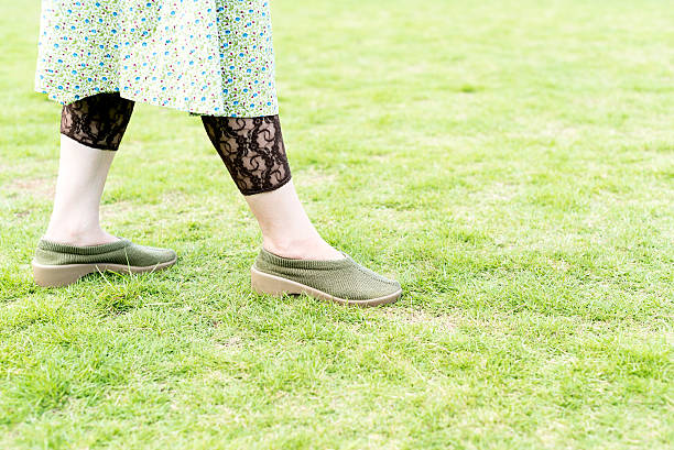 istock Walking woman on the green field 598961538