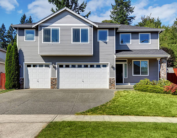 istock Exterior of luxurious grey house with double doors garage. 598962408