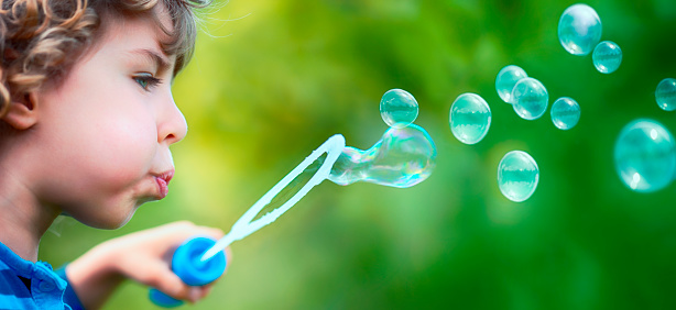 Child Have Fun with Soap Bubbles