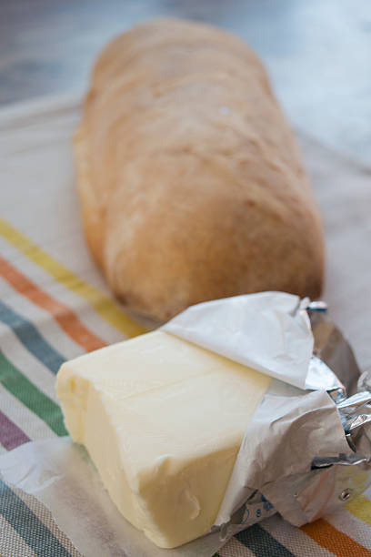 istock pat of butter on a bread loaf 598962750